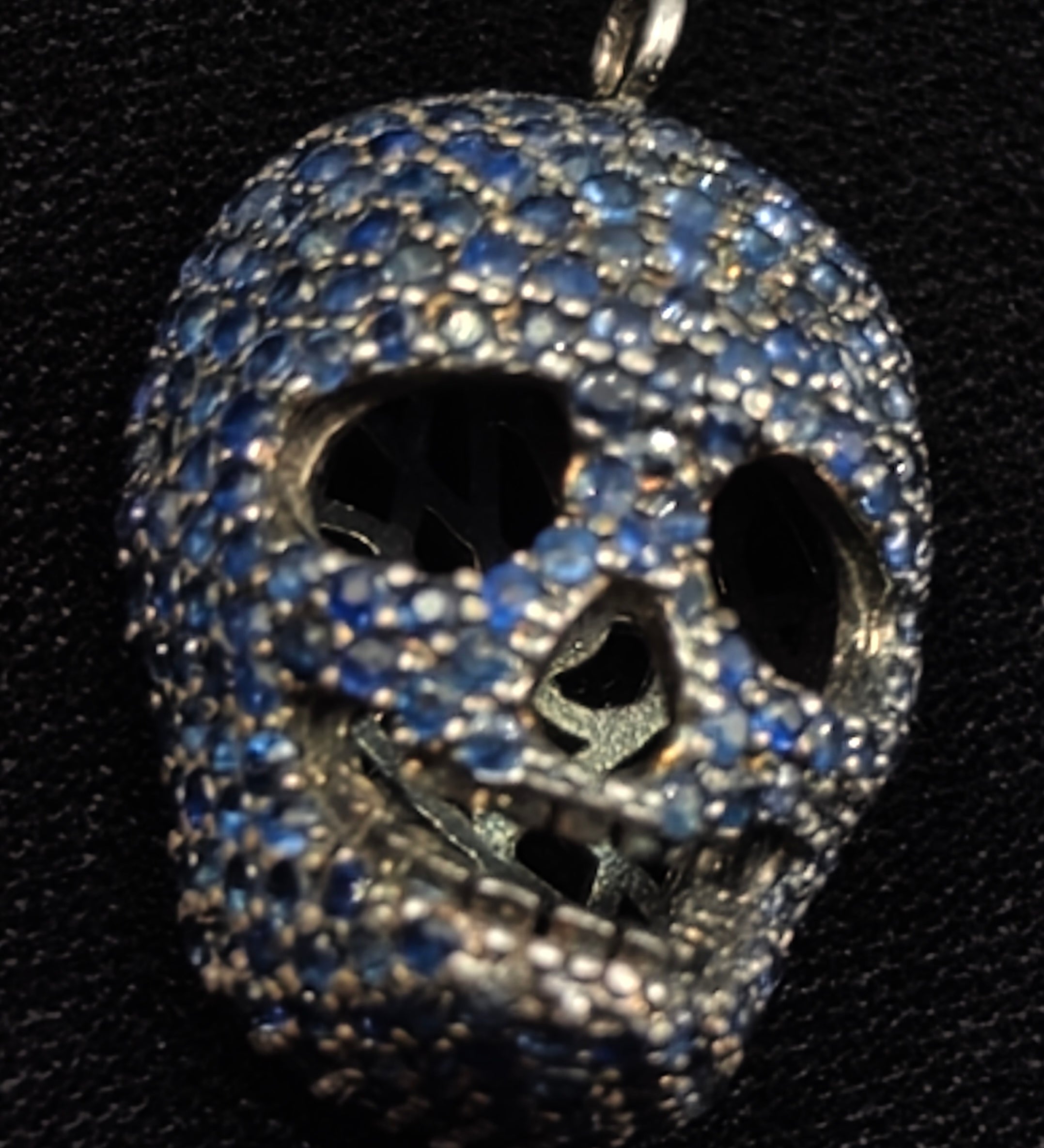 Blue sapphire skull pendant