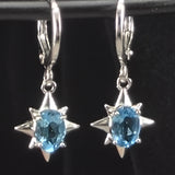 Topaz star dangle earrings